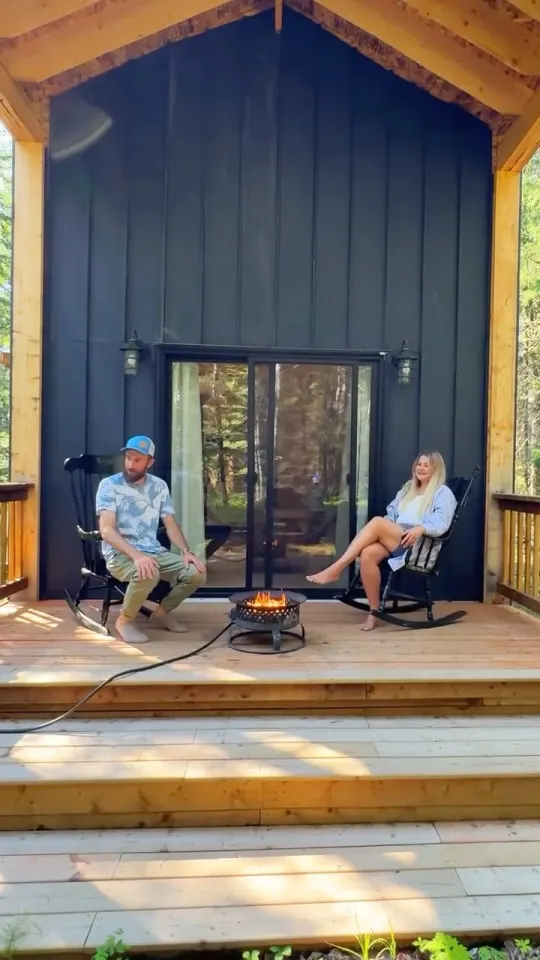 Couple on a cabin porch in a travel and stay UGC video