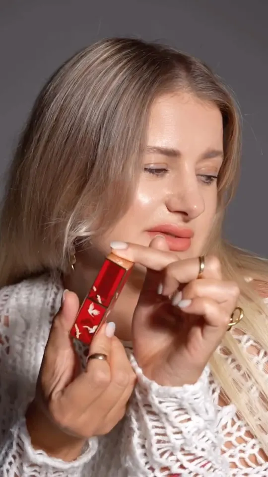 UGC creator applying Catkin lipstick in a beauty video